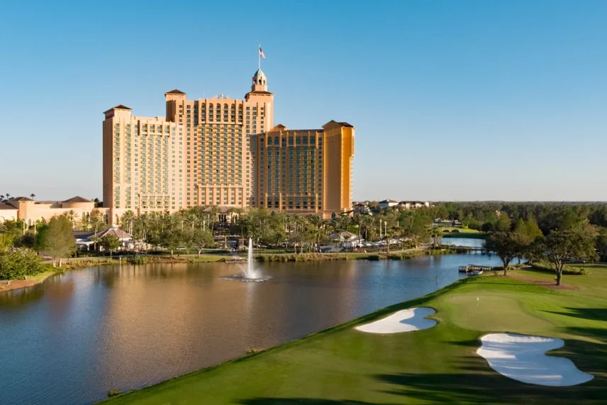 JW Marriott Orlando Grande Lakes - Luxury resort view showing pools, palm trees, and lakes